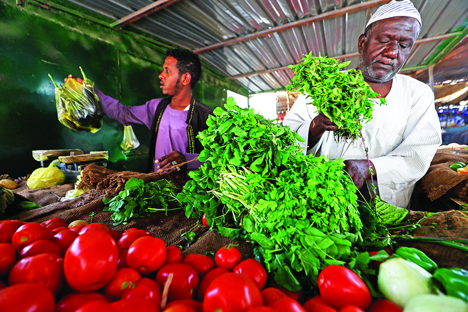 KHARTOUM, Sudan: Vegetable vendors sell fresh produce at a market in the Sudanese capital Khartoum.—AFPnn