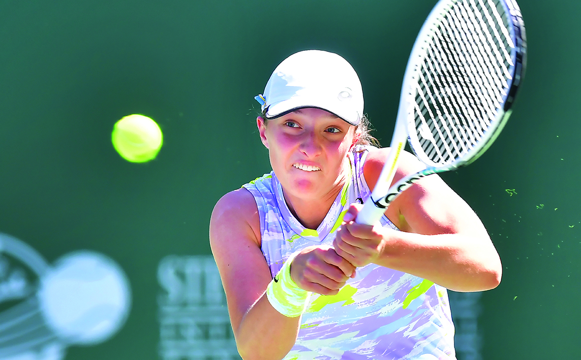 INDIAN WELLS, United States: Iga Swiatek, of Poland, hits a backhand return at the Indian Wells tennis tournament in Indian Wells, California. – AFPnn