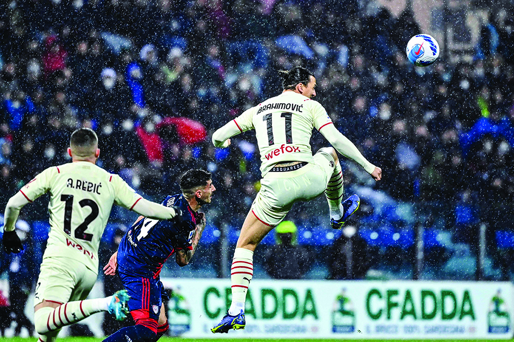 CAGLIARI: AC Milan’s Swedish forward Zlatan Ibrahimovic goes for the ball during the Italian Serie A football match between Cagliari and AC Milan, on March 19, 2022.- AFPn
