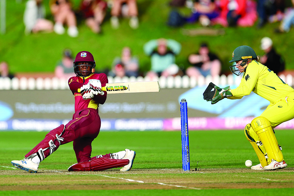 WELLINGTON: West Indies’ captain Stafanie Taylor plays a shot watched by the Australia’s wicketkeeper Alyssa Healy (right) during the Women’s Cricket World Cup semi-final match between Australia and the West Indies on March 30, 2022. - AFP