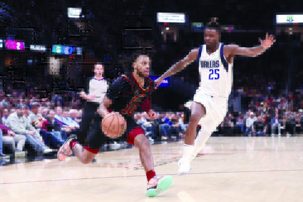 CLEVELAND: Darius Garland #10 of the Cleveland Cavaliers dribbles the ball during the game against the Dallas Mavericks on March 30, 2022 at Rocket Mortgage FieldHouse. - AFP