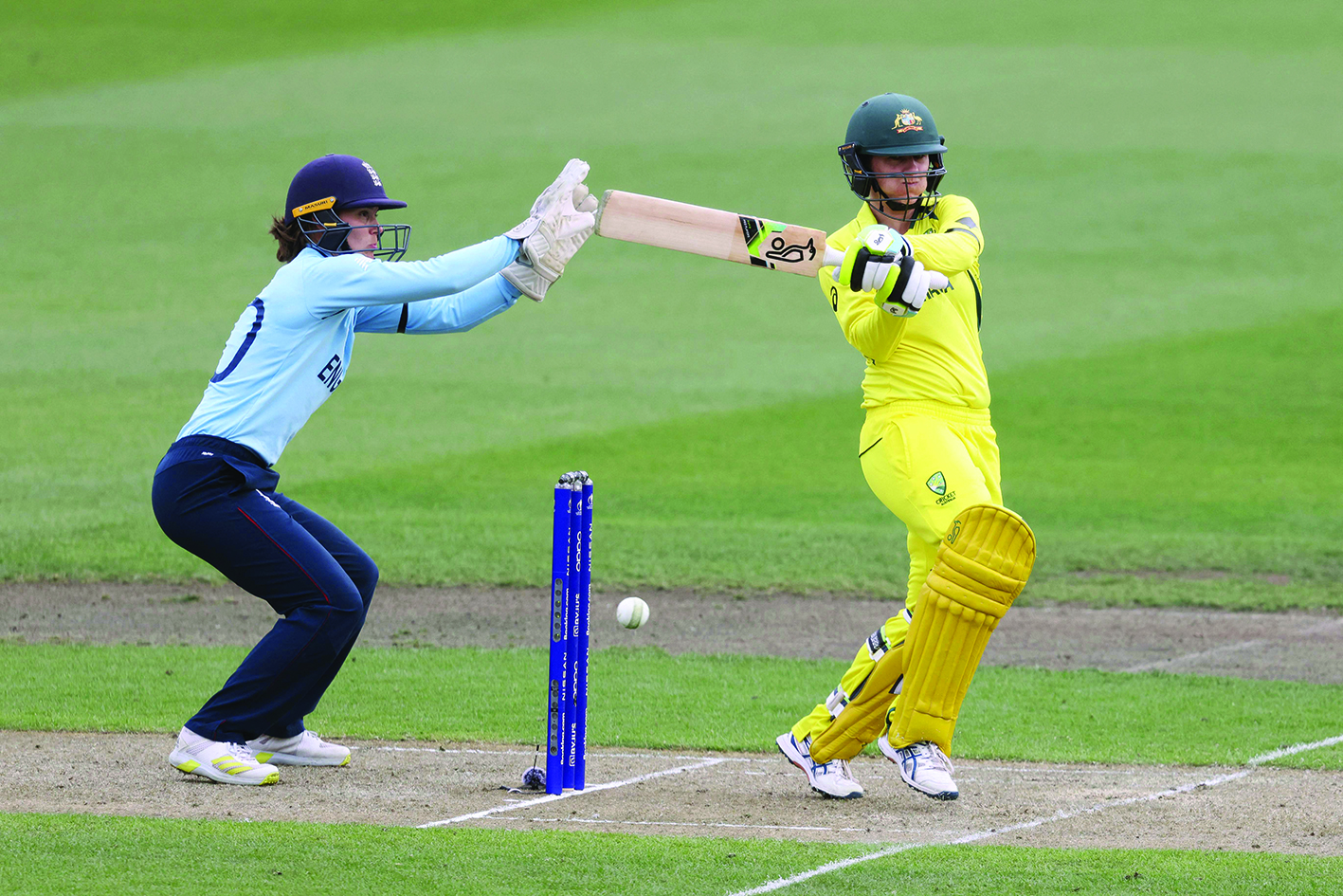 HAMILTON: Australia's Rachael Haynes plays a shot as England wicketkeeper Amy Jones (left) looks on during the Round 1 Women's World Cup Cricket match between Australia and England yesterday.- AFPn