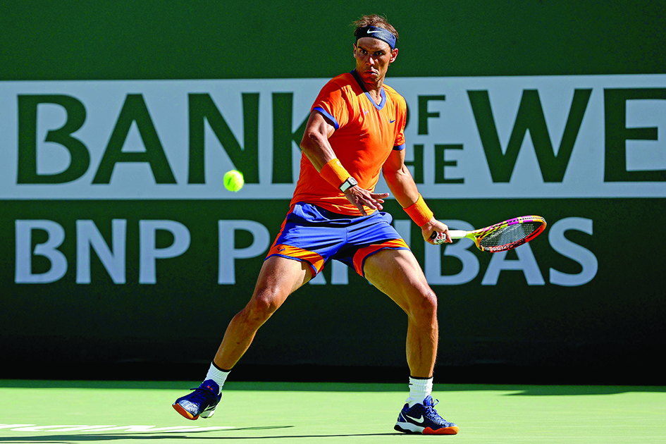 INDIAN WELLS: Rafael Nadal of Spain returns a shot to Reilly Opelka during the BNP Paribas Open at the Indian Wells Tennis Garden on March 16, 2022.- AFPn