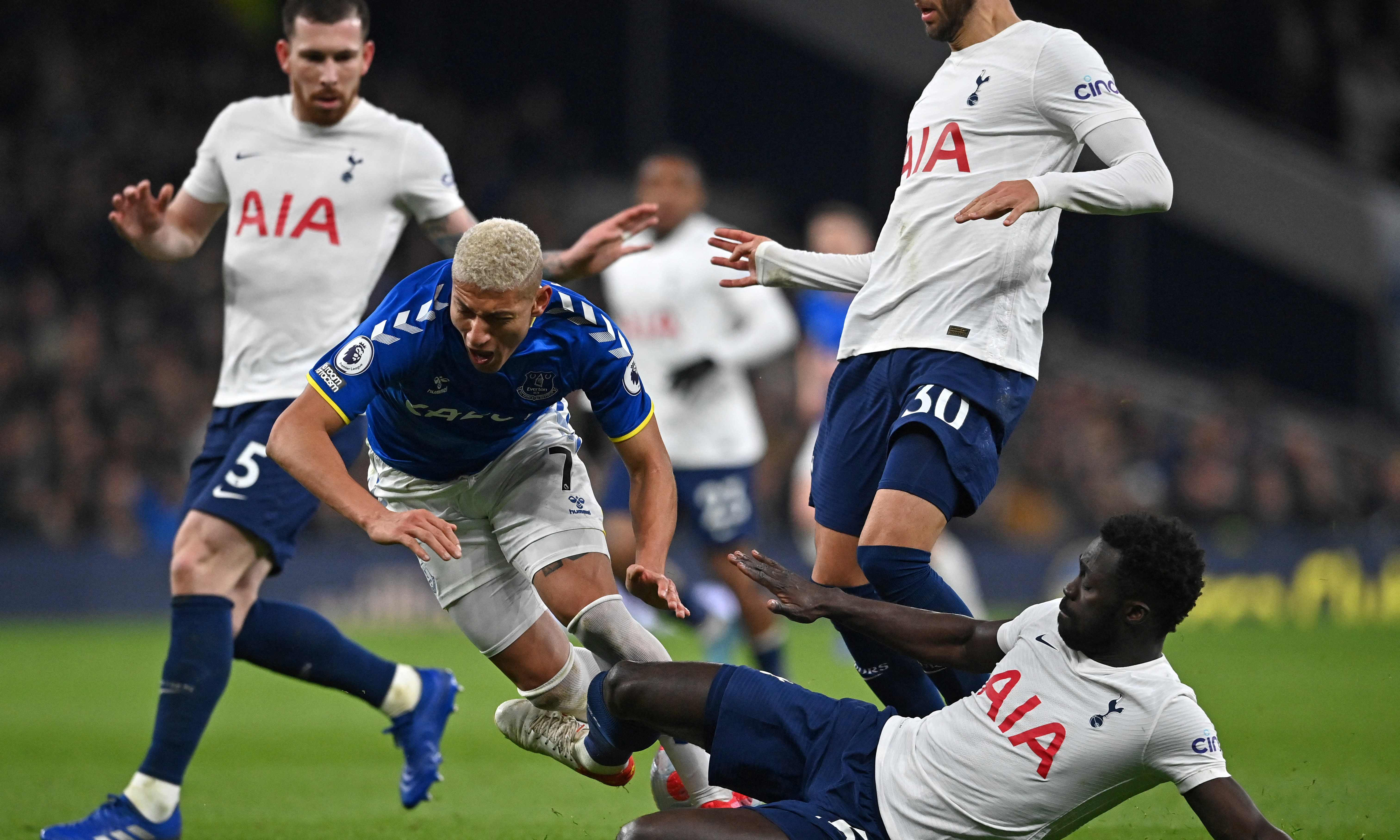 LONDON: Tottenham Hotspur's Colombian defender Davinson Sanchez (right) fouls Everton's Brazilian striker Richarlison during the English Premier League football match between Tottenham Hotspur and Everton on March 7, 2022. - AFPn