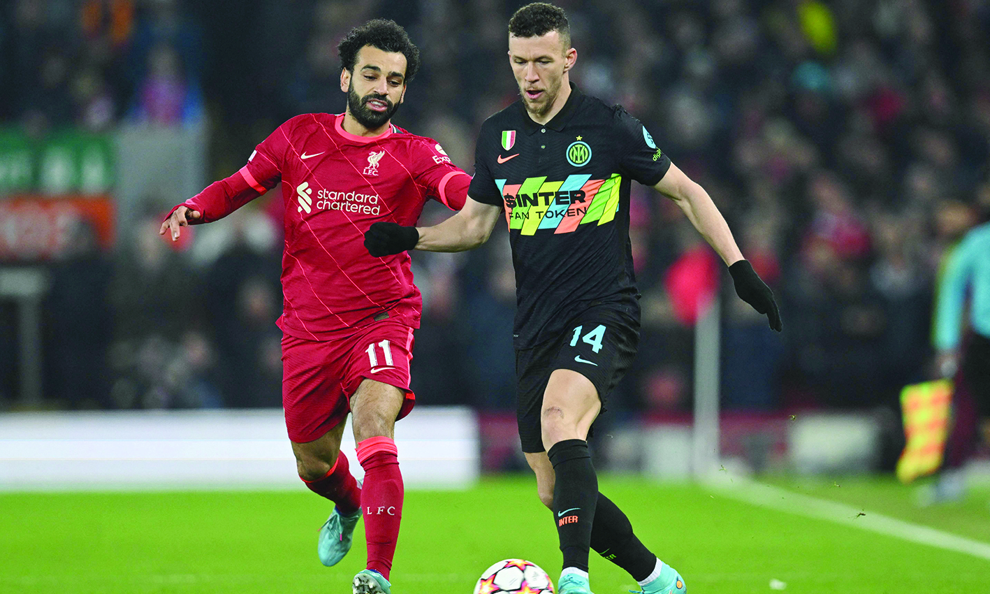 LIVERPOOL: Inter Milan's Croatian midfielder Ivan Perisic vies with Liverpool's Egyptian midfielder Mohamed Salah during the UEFA Champions League round of 16 second leg match at Anfield on Tuesday. - AFP n