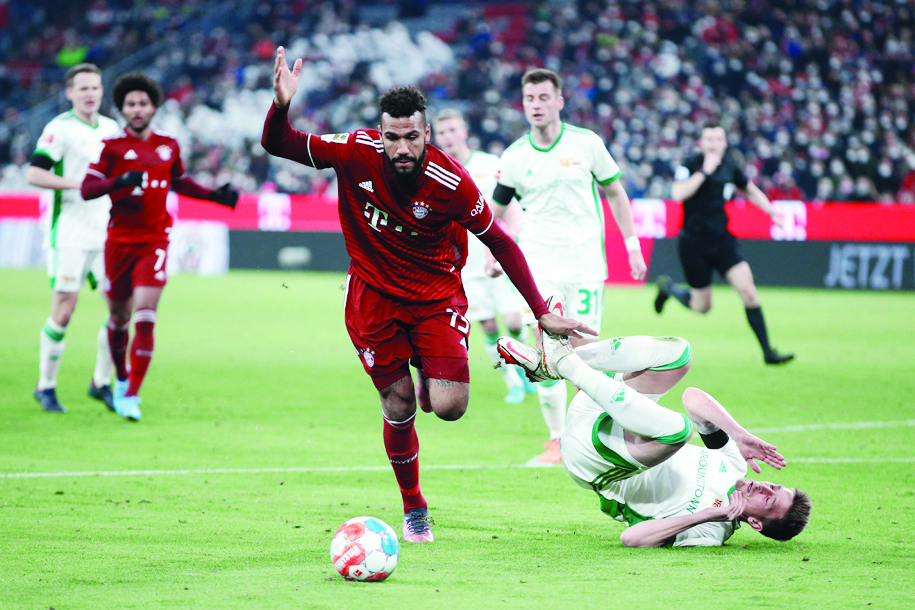 MUNICH: Bayern Munich's Cameroonian forward Eric Maxim Choupo-Moting (left) vies for the ball with Union Berlin's Hungarian midfielder Andras Schaefer during the German first division Bundesliga football match FC Bayern Munich v FC Union Berlin on March 19, 2022. - AFPn