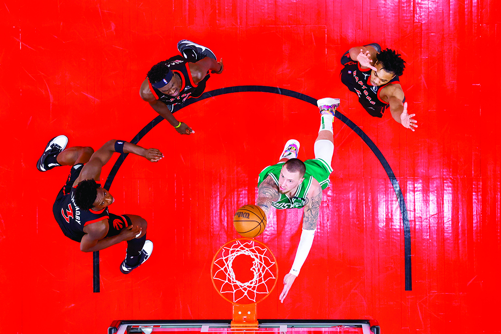 TORONTO: Daniel Theis #27 of the Boston Celtics drives to the basket during the game against the Toronto Raptors on March 28, 2022 at the Scotiabank Arena in Toronto, Ontario.- AFP photos