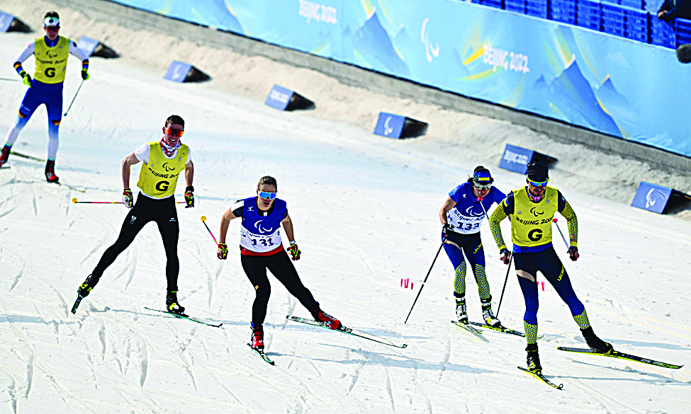 ZHANGJIAKOU, China: Austria's Carina Edlinger (C-#131) and Ukraine's Oksana Shyshkova (second right #132) compete in the women's sprint free vision impaired cross country final yesterday at the Zhangjiakou National Biathlon Centre during the Beijing 2022 Winter Paralympic Games. - AFP n