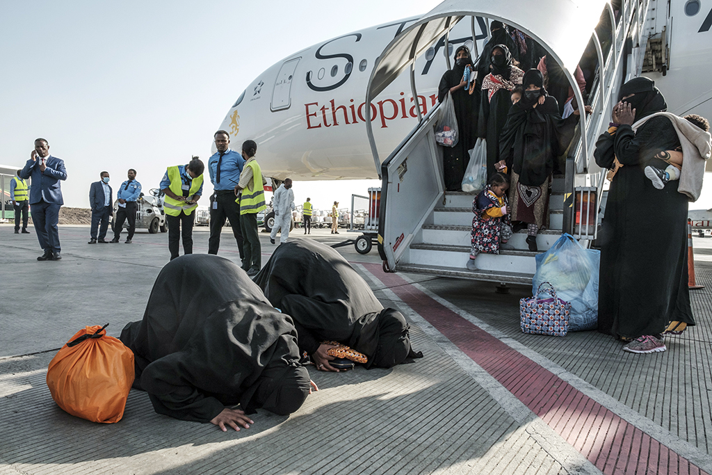 ADDIS ABABA: Ethiopian women repatriated from Saudi Arabia react as they disembark from the airplane at Bole Airport on March 30, 2022. - AFP