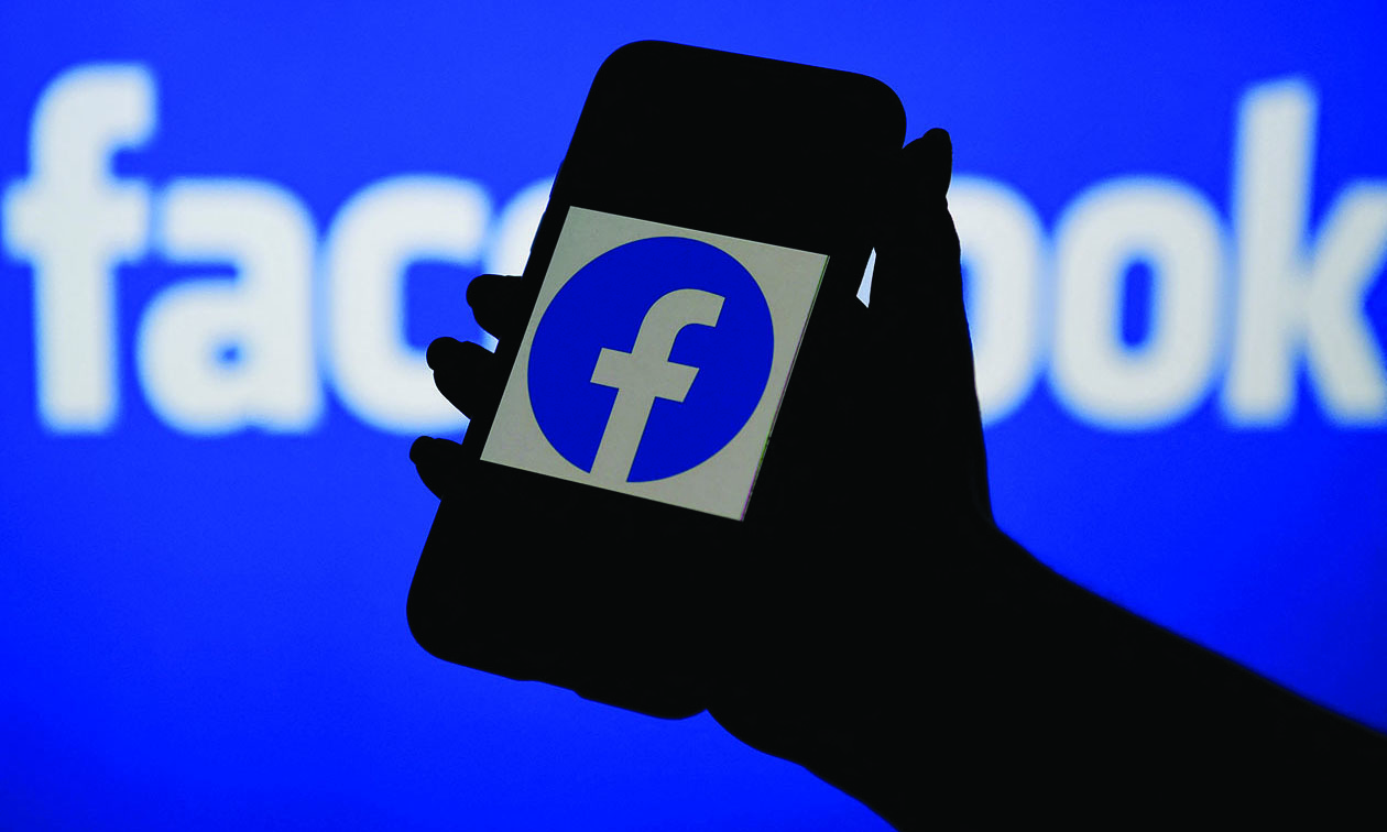 NEW YORK: A smart phone screen displays the logo of Facebook in Arlington, Virginia.- AFPn