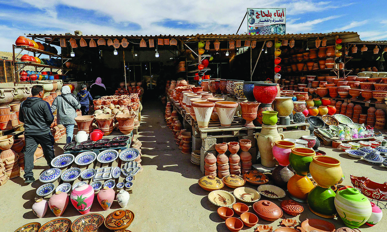 Locally made ceramics are displayed in front of a shop in the town of Gharyan, about 100 km (60 miles) southwest of the capital Tripoli, on February 5, 2022. - Gharyan sculpted a reputation for ceramics generations ago, but fragile demand is forcing potters to seek new markets on Instagram and Facebook. (Photo by Mahmud TURKIA / AFP)