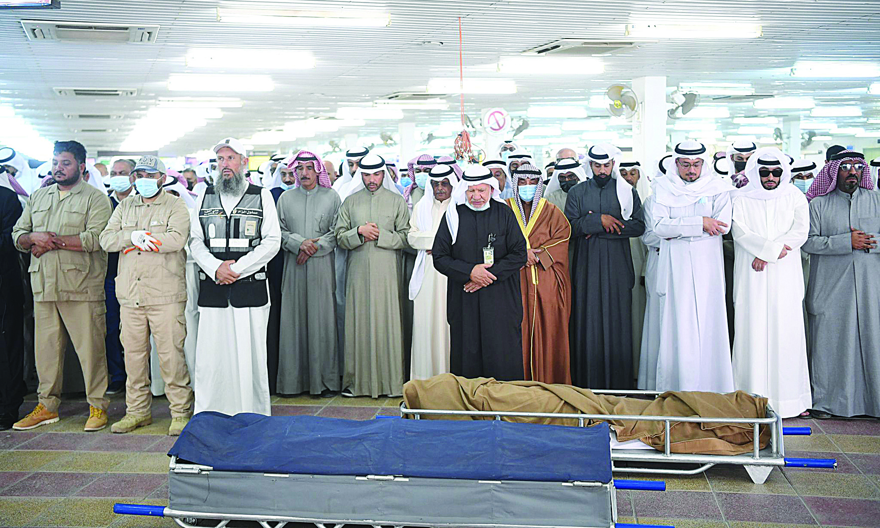 KUWAIT: Mourners perform the funeral pray during the funeral of Dr Ahmad Al-Khatib yesterday. - Photos by Yasser Al-Zayyatn