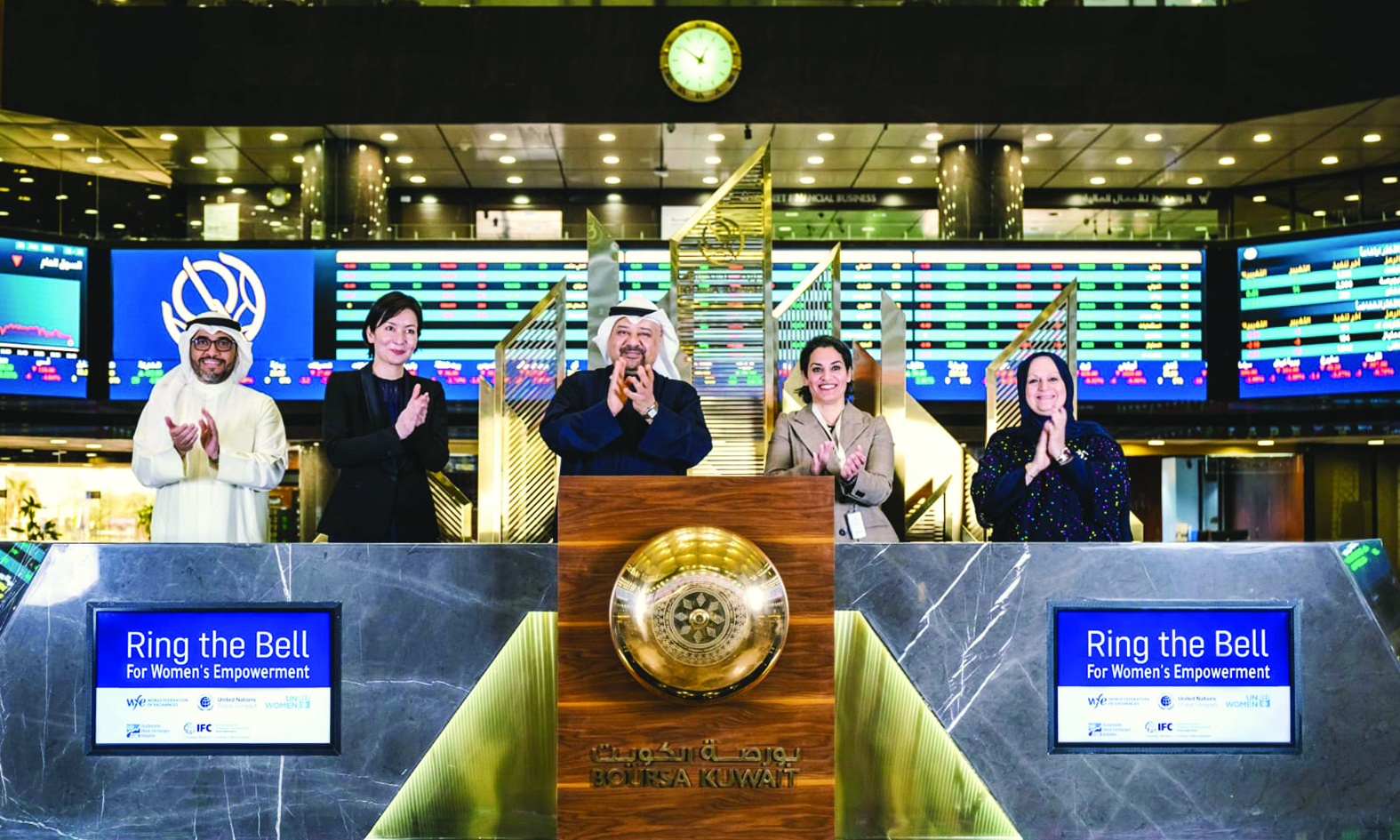 KUWAIT: Officials applaud after ringing the closing bell at Boursa Kuwait on International Women's Day yesterday.n