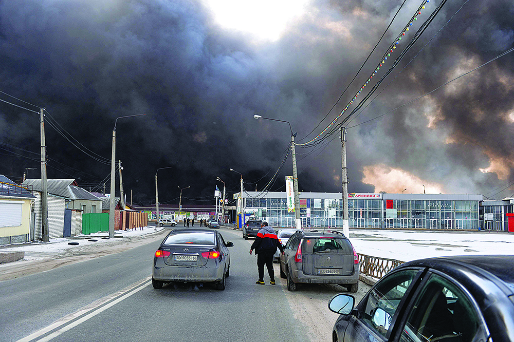 KHARKIV: Black smoke rises into the sky from the Barabashovo market - one of the largest markets in the eastern Europe covering an area of more than 75 hectares - which is reportedly hit by shelling, in Kharkiv yesterday amid the ongoing Russia's invasion of Ukraine. - AFPn