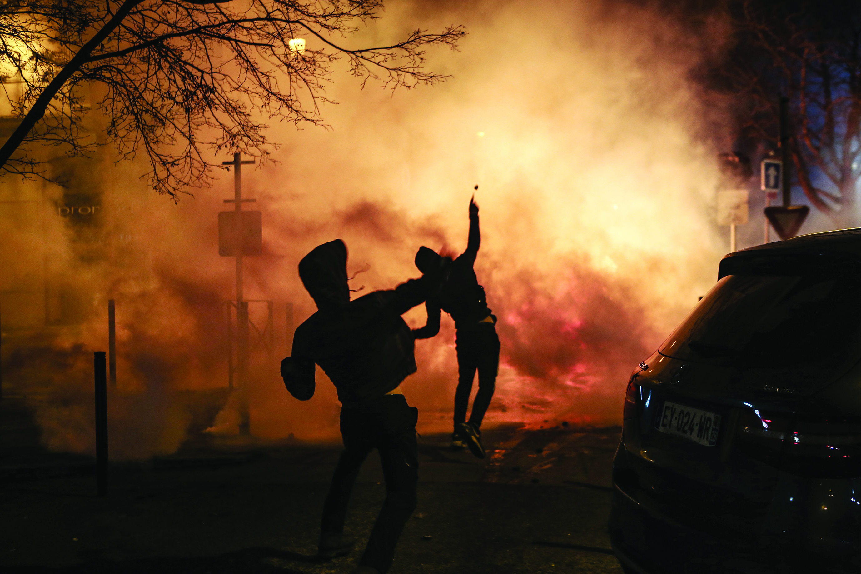 BASTIA, France: Protesters throw projectiles during clashes with police following a rally in support to Corsican nationalist figure Yvan Colonna a week after he was attacked in prison, in Bastia, Corsica, on Sunday.-AFPn