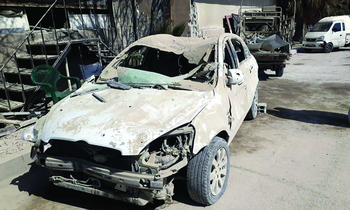 DAMASCUS: A handout picture released by the official Syrian Arab News Agency (SANA) shows a damaged car following Zionist missile strikes before dawn near the capital Damascus. - AFPnn