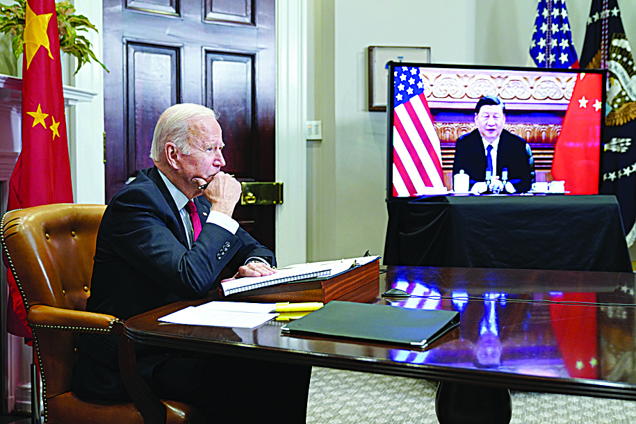 WASHINGTON: In this file photo taken on November 15, 2021, US President Joe Biden meets with China's President Xi Jinping during a virtual summit from the Roosevelt Room of the White House in Washington, DC. - AFPnn