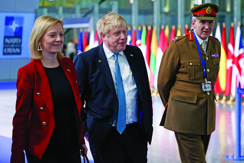BRUSSELS, Belgium: File photo shows Britain's Prime Minister Boris Johnson (C) Britain's Foreign Secretary Liz Truss (L) and Britain's military representative to NATO Ben Bathurst (R) leave NATO Headquarters following a summit in Brussels on March 24, 2022. – AFP