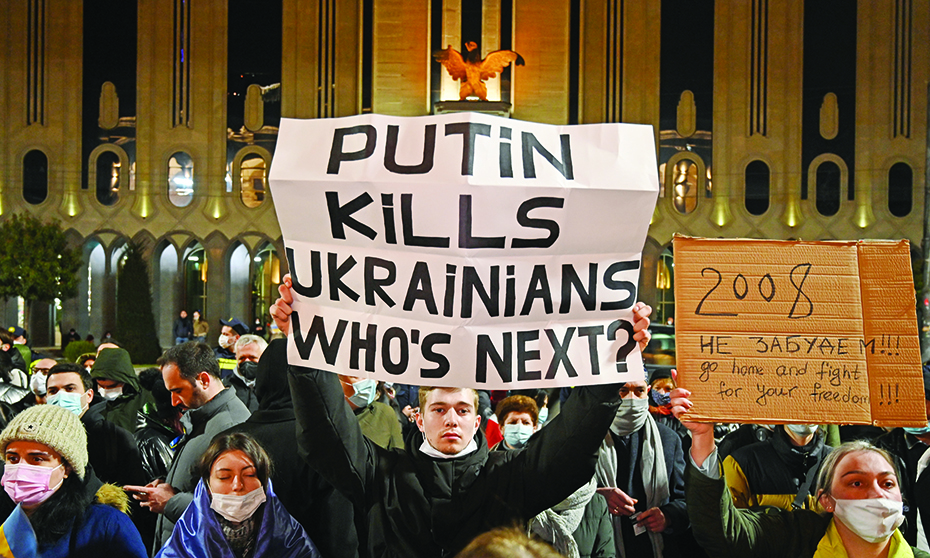 TBILISI, Georgia: Demonstrators hold posters during a rally in support of Ukraine in Tbilisi. – AFPnn