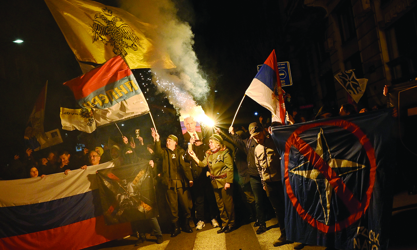 BELGRADE, Serbia: People hold Russian and Serbian flags and a picture of Russian President Vladimir Putin during a rally organised by Serbian right-wing organisations in support of Russian invasion in Ukraine, in Belgrade. – AFPnn
