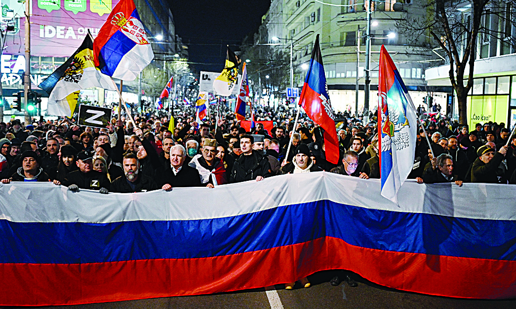 BELGRADE, Serbia: People wave Russian and Serbian flags during a rally organised by Serbian right-wing organisations in support of Russian invasion in Ukraine, in Belgrade.-AFPn