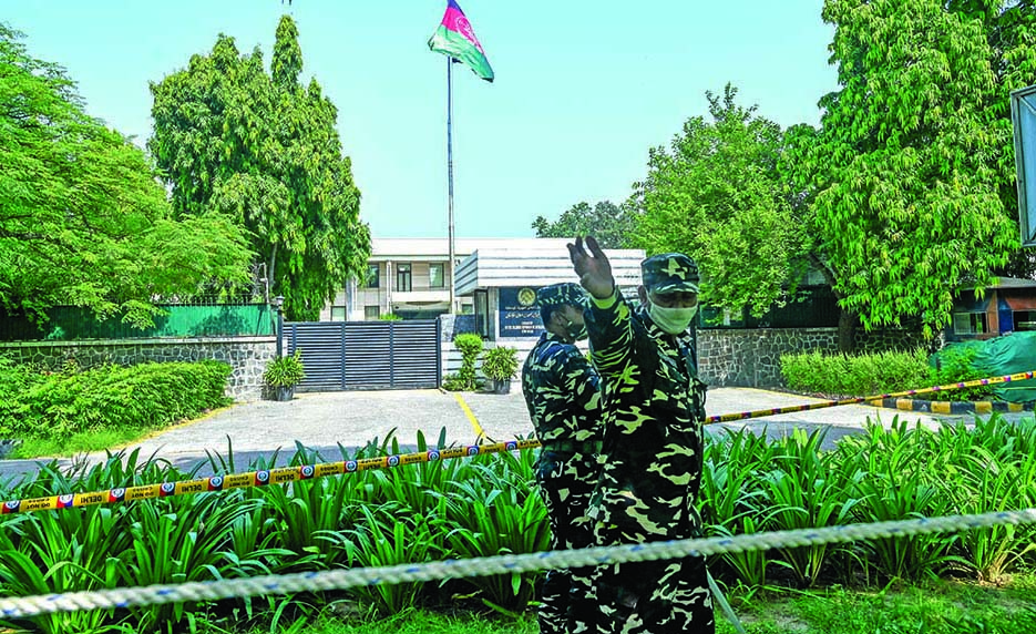 NEW DELHI: In this file photo taken on August 17, 2021, security personnel stand guard outside the Afghan embassy in New Delhi. – AFPn