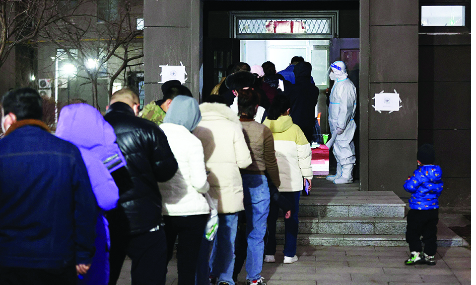 CHANGCHUN, China: Residents queue to undergo nucleic acid tests for COVID-19 on Friday. – AFP n