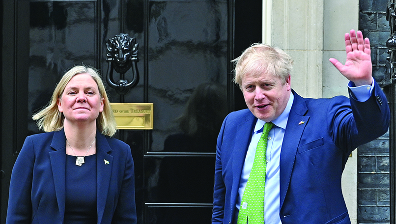 LONDON: Britain’s Prime Minister Boris Johnson (right) welcomes Sweden’s Prime Minister Magdalena Andersson (left) at 10 Downing Street yesterday. The UK yesterday added 350 more Russians to its sanctions list, hiked tariffs on a swathe of imports in retaliation for Moscow’s invasion of Ukraine. – AFPn