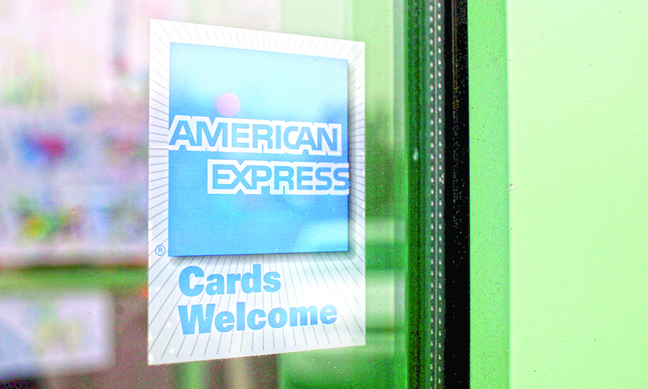 DES PLAINES, US: In this file photo taken on November 11, 2008, a sign showing the American Express logo is seen outside of a restaurant in Des Plaines, Illinois. - AFPnn