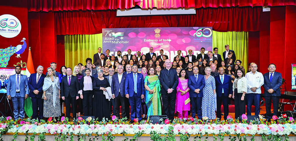Indian Ambassador Sibi George poses for a group photo with the dignitaries and members of the Kuwait Chamber Chorale pose for a group photo.