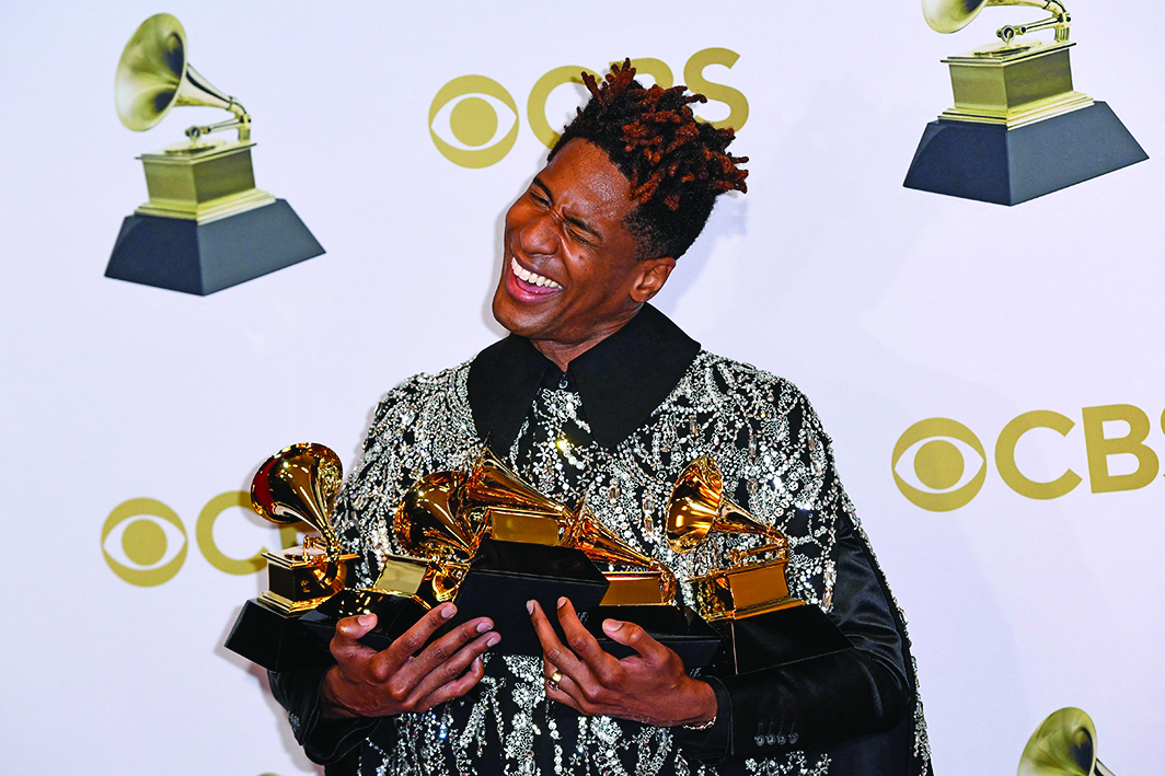 US singer Jon Batiste poses in the press room with his Grammys during the 64th Annual Grammy Awards at the MGM Grand Garden Arena in Las Vegas.—AFP photos