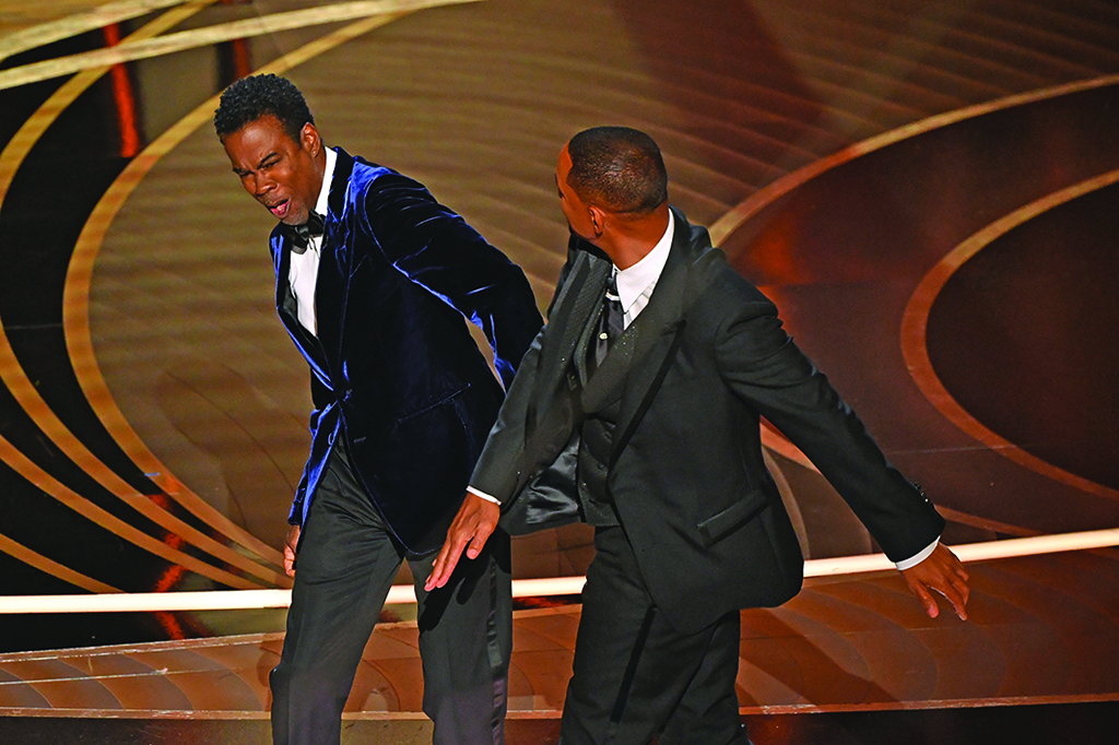 In this file photo US actor Will Smith (right) slaps US actor Chris Rock onstage during the 94th Oscars at the Dolby Theatre in Hollywood, California. – AFP
