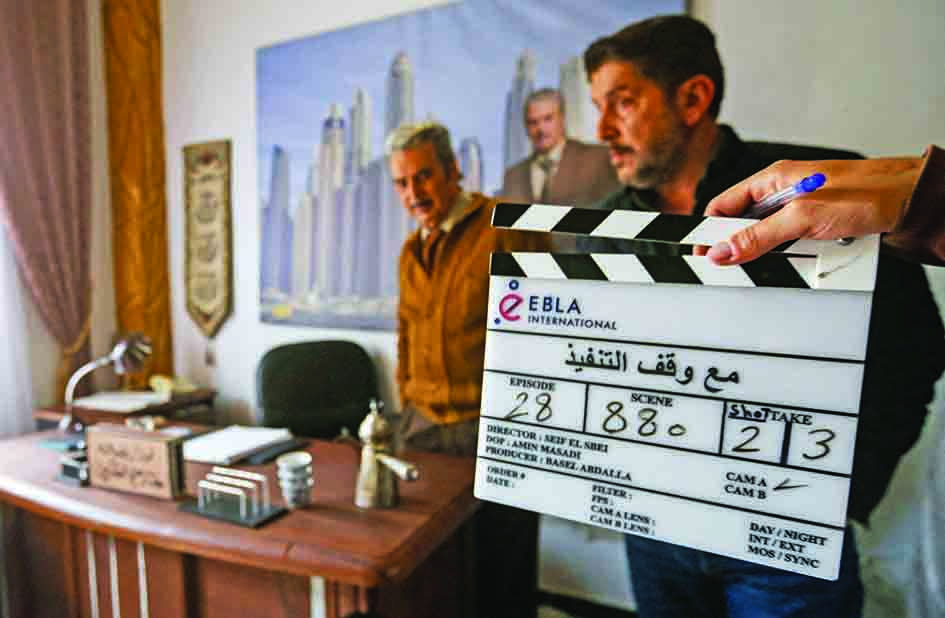 Syrian actors Abbas Al-Nuri (left) and Yazan al Kahlil prepare to play a scene for the Syrian Social series 