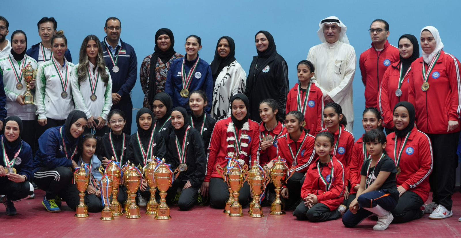 KUWAIT: The winning teams pose with their trophies.