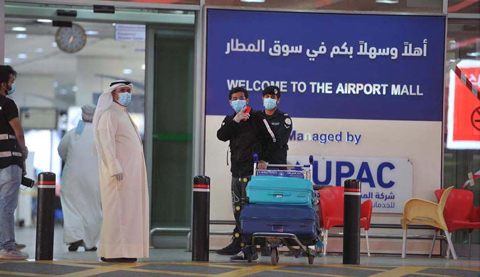 KUWAIT: Photo shows Kuwait security operatives and passengers at Kuwait Airport. The Council of Ministers yesterday effectively lifted all measures that were imposed to contain the coronavirus disease - making wearing face masks anywhere optional.- Photo by Yasser Al-Zayyat