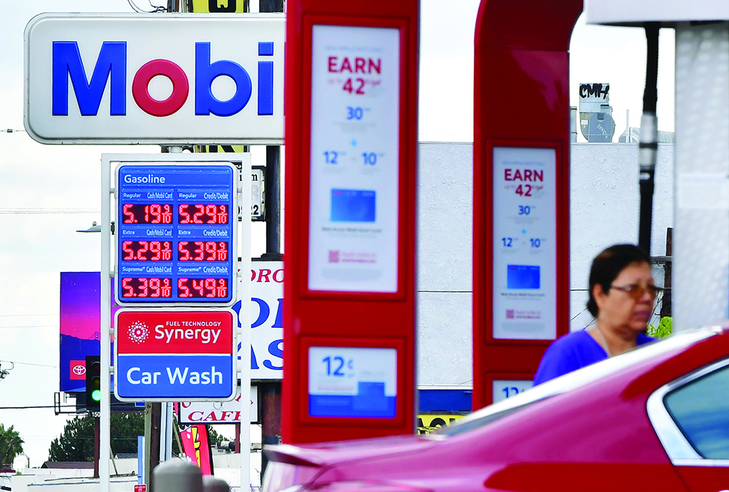LOS ANGELES: In this file photo taken, gas prices are posted at a Mobil petrol station in Los Angeles.-- AFP