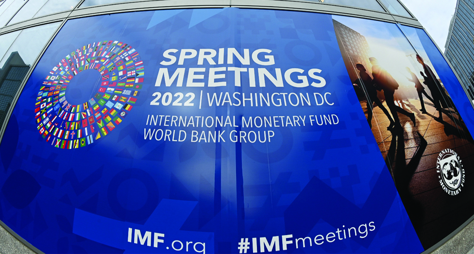 WASHINGTON: A poster advertises the Spring Meetings at the International Monetary Fund headquarters in Washington, DC on April 21, 2022. - AFP