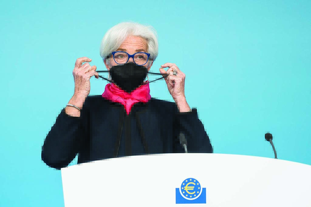FRANKFURT: In this file photo taken on December 16, 2021 European Central Bank (ECB) President Christine Lagarde takes her protective face mask off to address a press conference following a meeting of the governing council of the ECB on the eurozone monetary policy in Frankfurt am Main, western Germany. - AFP