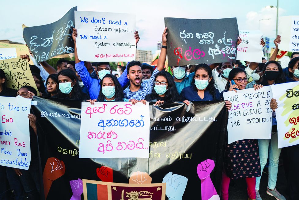 COLOMBO: Protesters shout slogans during an ongoing anti-government demonstration near the president's office in Colombo on April 18, 2022, demanding President Gotabaya Rajapaksa's resignation over the country's crippling economic crisis. - AFP