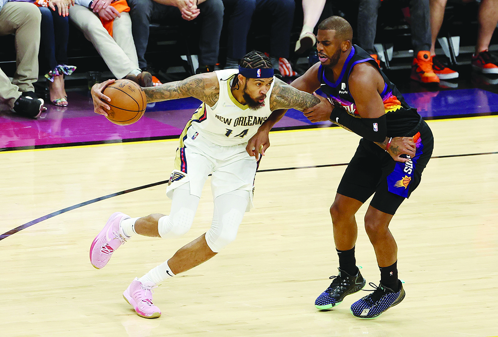 PHOENIX: Brandon Ingram #14 of the New Orleans Pelicans handles the ball against Chris Paul #3 of the Phoenix Suns during the first half of Game Two of the Western Conference First Round NBA Playoffs at Footprint Center on April 19, 2022. - AFP