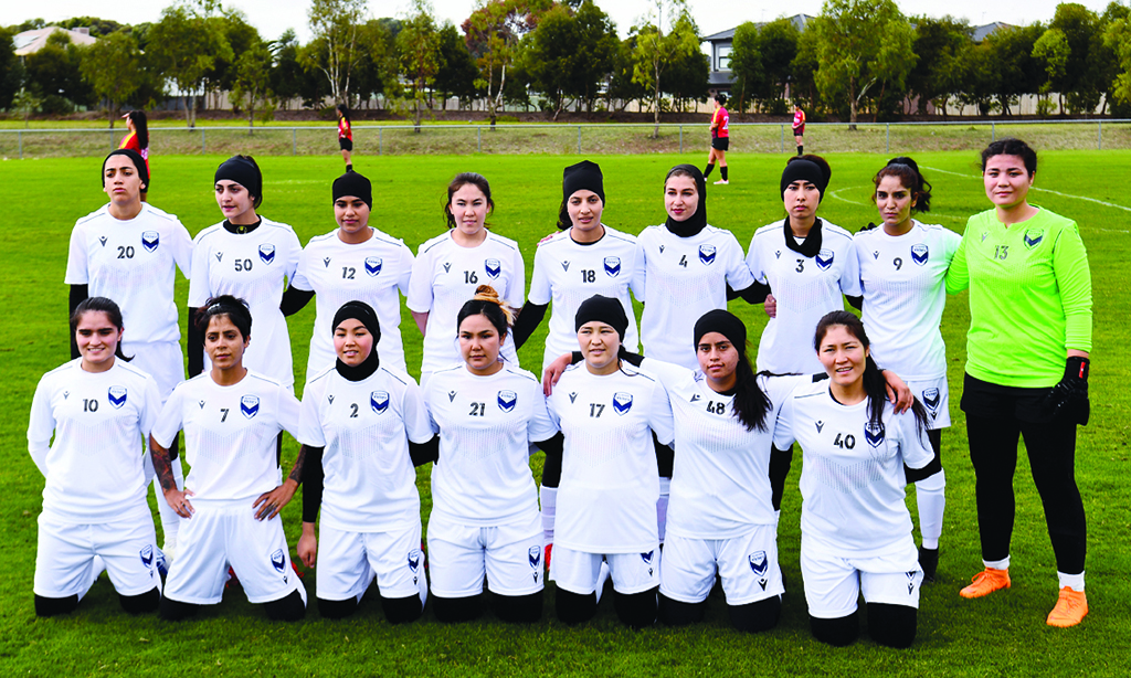 MELBOURNE: Members of the Melbourne Victory Afghan women's team pose for a team photo before their first match in a local league against ETA Buffalo SC on April 24, 2022. - AFP