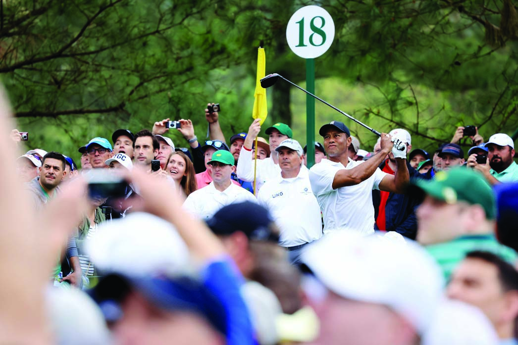 AUGUSTA, Georgia: Tiger Woods of the United States plays his shot from the 18th tee during a practice round prior to the Masters at Augusta National Golf Club on April 6, 2022. - AFP