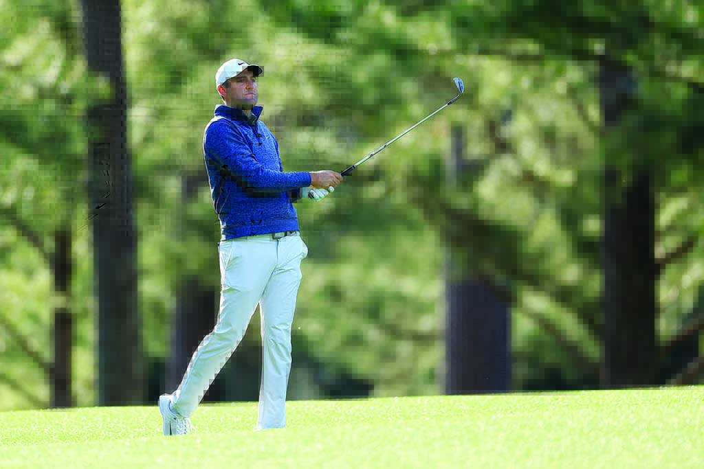 AUGUSTA: Scottie Scheffler follows his shot on the 14th hole during the third round of the Masters at Augusta National Golf Club on April 9, 2022. – AFP