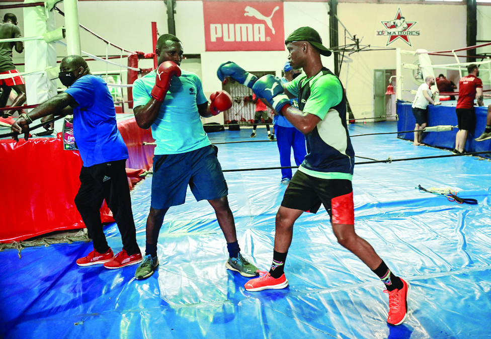 HAVANA: Cuban Olympic boxers Julio Cesar La Cruz and Roniel Iglesias take part in a training session at the Cuban National Boxing School on April 7, 2022. - AFP