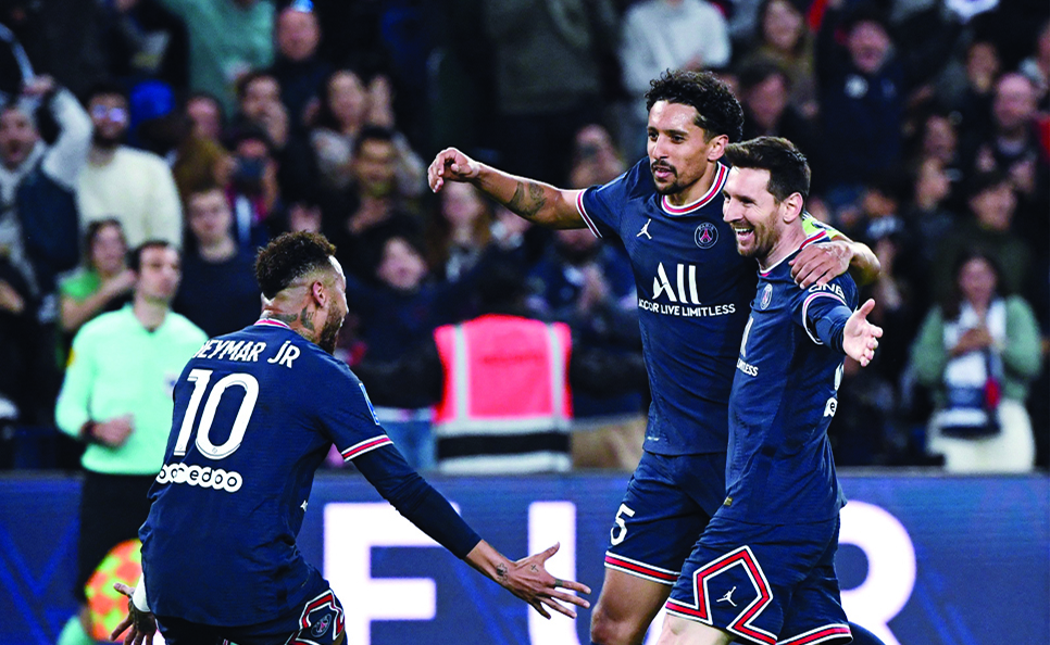 PARIS: Paris Saint-Germain's Argentinian forward Lionel Messi celebrates after opening the scoring with Brazilian forward Neymar and Brazilian defender Marquinhos during the French L1 match between against Lens at The Parc des Princes Stadium on April 23, 2022. - AFP