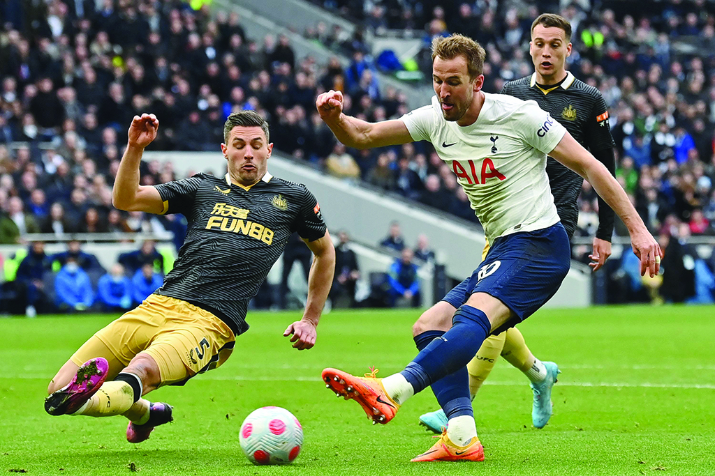LONDON: Tottenham Hotspur's English striker Harry Kane has this shot blocked by Newcastle United's Swiss defender Fabian Schar during their English Premier League match at Tottenham Hotspur Stadium on April 3, 2022. – AFP