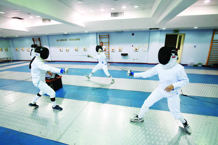 KUWAIT: Female epeeists participate in the fencing championship on Monday. - Photos by Yasser Al-Zayyatn