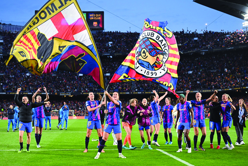 BARCELONA: Barcelona's Spanish midfielder Alexia Putellas and teammates celebrate their victory at the end of the UEFA Women's Champions League semifinal first-leg match against Wolfsburg at the Camp Nou stadium on April 22, 2022. - AFP