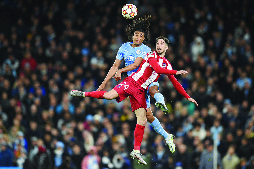 MANCHESTER: Manchester City's Dutch defender Nathan Ake vies with Atletico Madrid's Croatian defender Sime Vrsaljko during their UEFA Champions League quarterfinal first leg match at the Etihad Stadium on April 5, 2022. – AFP
