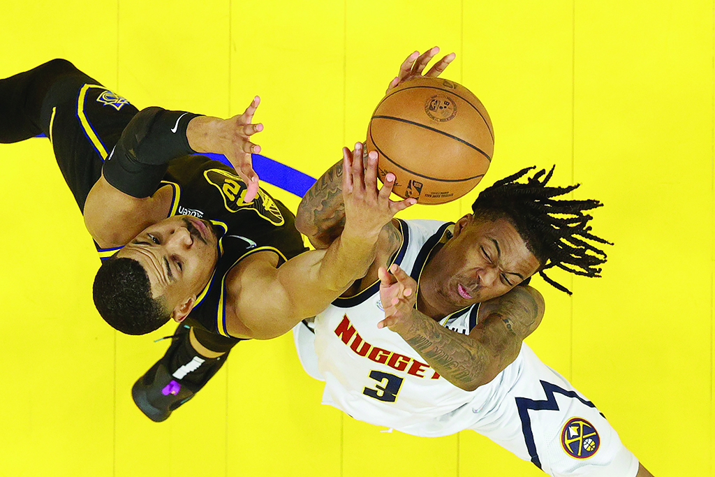 SAN FRANCISCO: Otto Porter Jr #32 of the Golden State Warriors and Bones Hyland #3 of the Denver Nuggets go for a rebound during Game One of the Western Conference First Round NBA Playoffs at Chase Center on April 16, 2022. - AFP